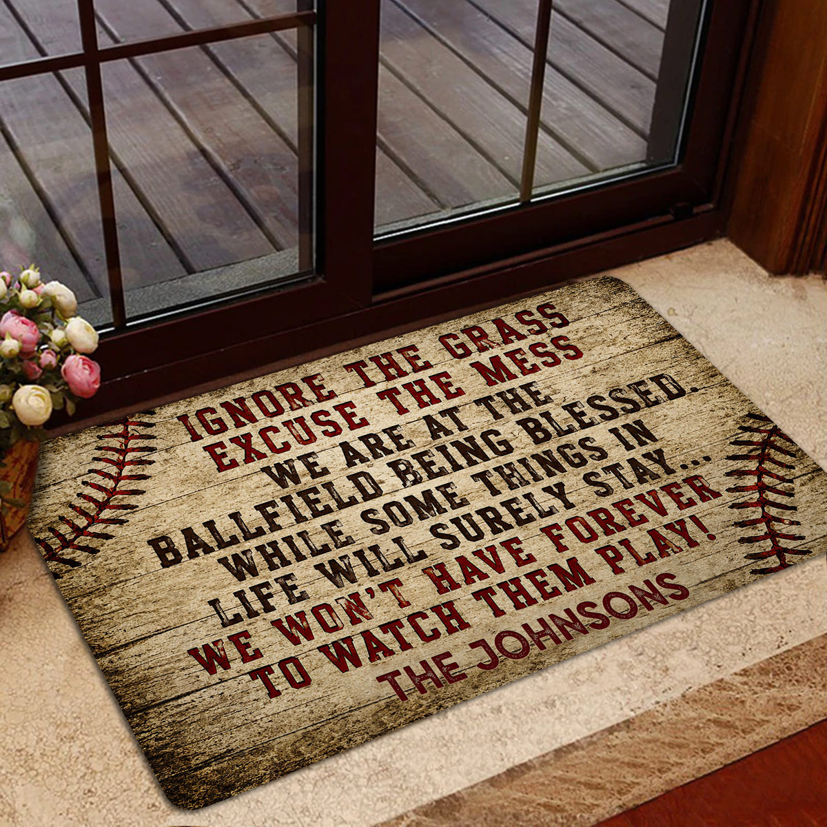Baseball-themed rug staged inside a glass entryway with rustic typography and ball stitching artwork