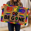 LGBT Pride doormat with rainbow border and Be Kind artwork shown in a home setting