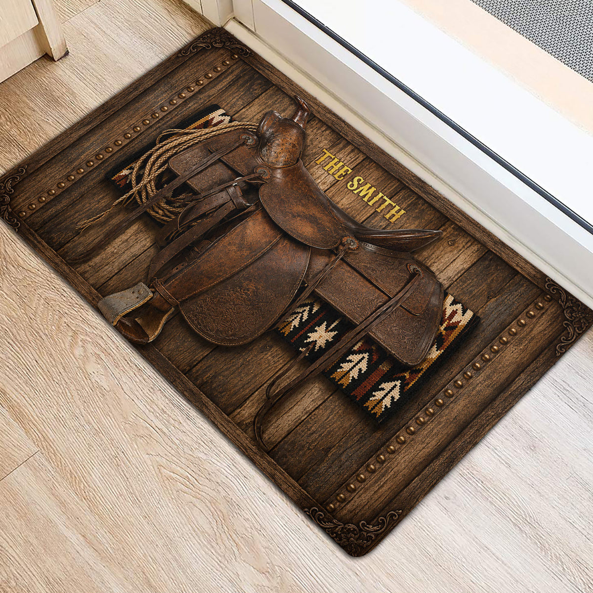 Rustic cowboy saddle and rope doormat placed near a bright home entrance