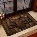 Cowboy saddle entryway doormat displayed beside a glass door in a warm home setting