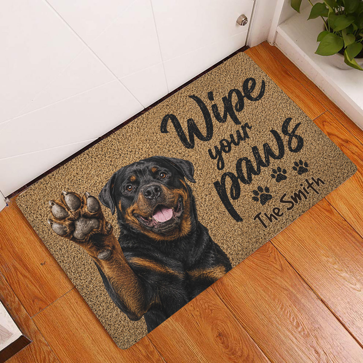 Rottweiler welcome doormat displayed inside a home entryway on a wood floor