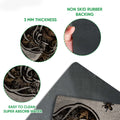 Close-up feature view of the bear doormat print and dark rubber backing with rounded edges