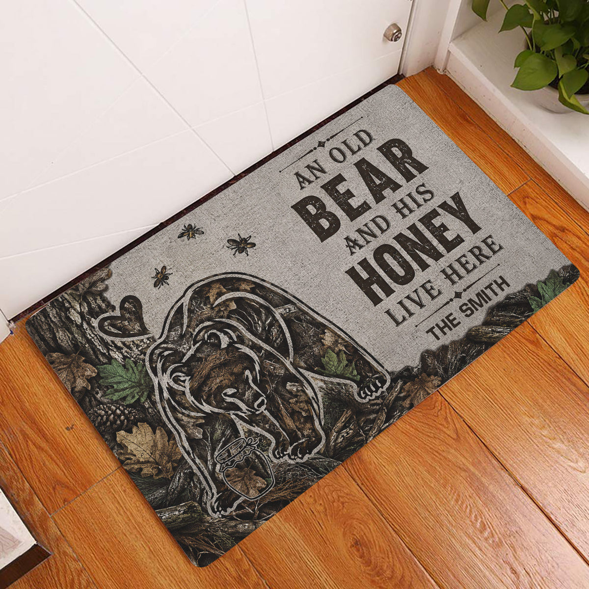 Bear entryway rug displayed beside a white door on warm wood flooring with woodland artwork