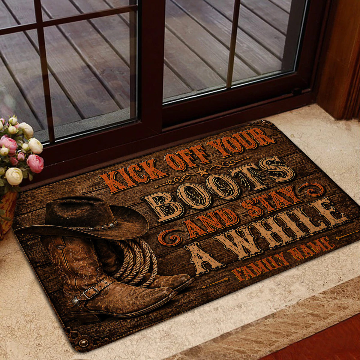 Rustic cowboy welcome doormat displayed by a glass entry door with boots and rope artwork