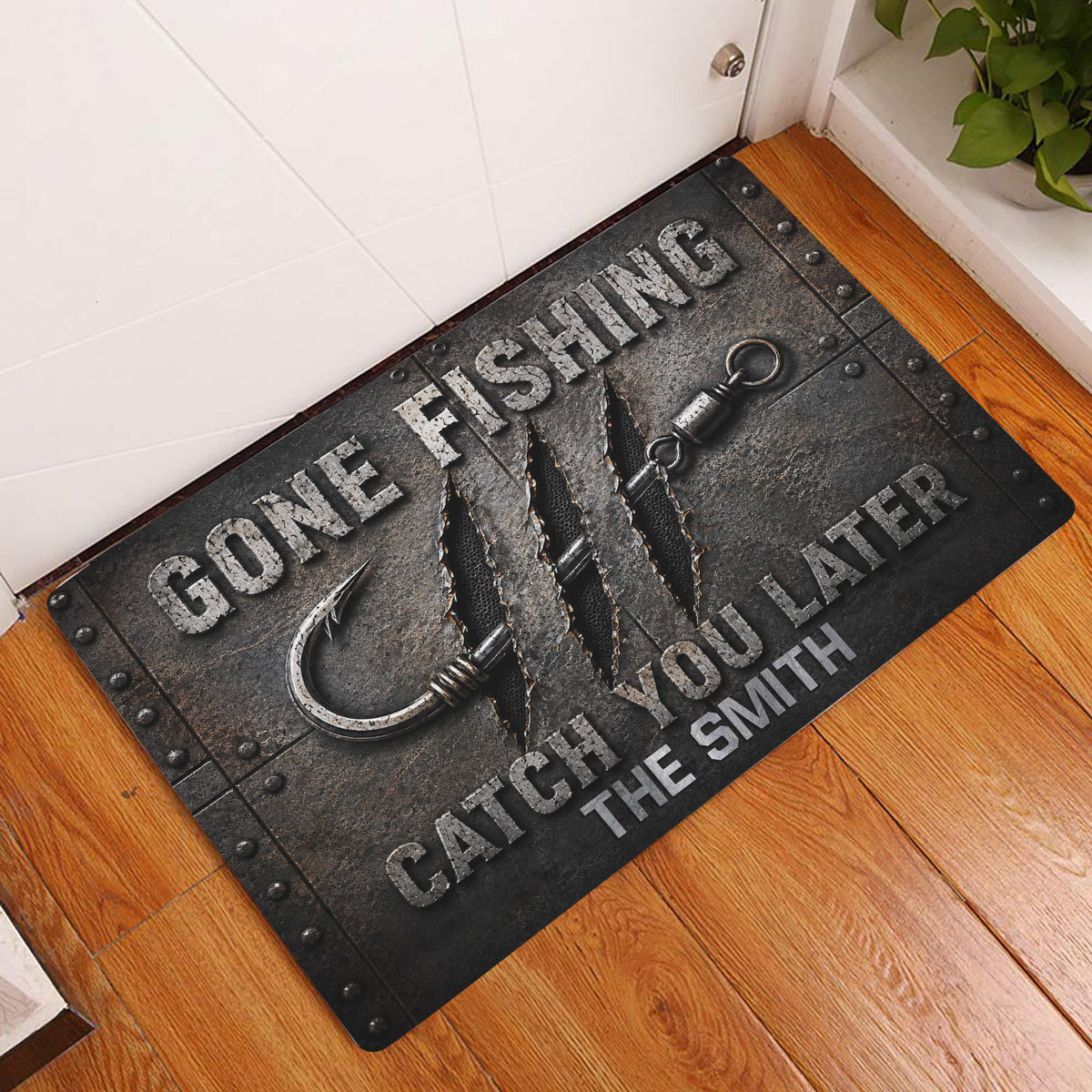 Fishing doormat displayed at an indoor entryway on a wood floor beside a white door