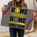 Softball doormat held indoors showing home-themed artwork with a softball, bat, glove, and red stitching