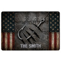 Fishing-themed doormat with large hooks, rugged metal texture, star-and-stripe border, and bold central lettering