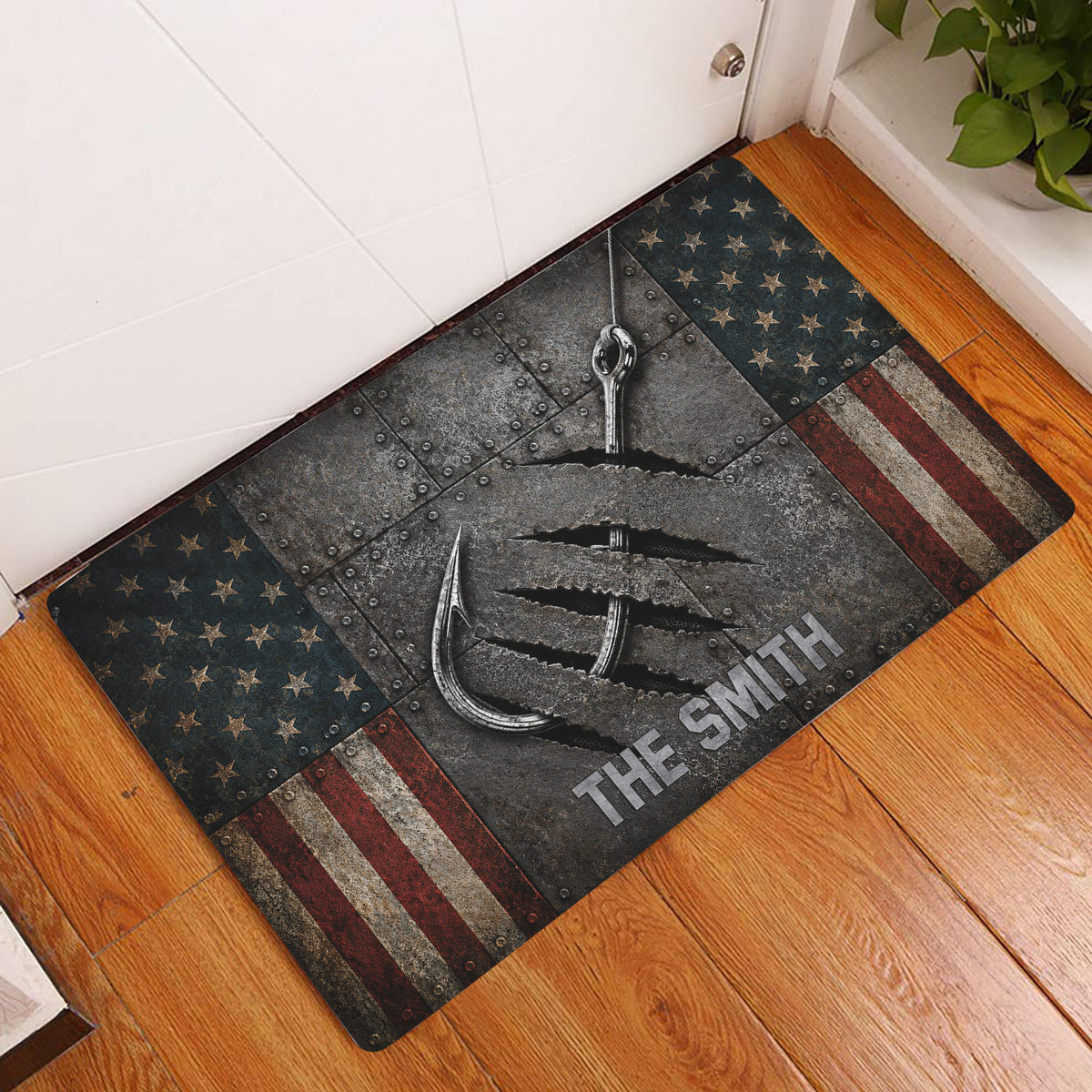 Fishing hook and rugged star-and-stripe doormat displayed in an indoor entryway on a wood floor