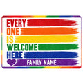 Rainbow pride LGBT doormat with colorful brushstroke stripes, welcome message, heart, and family text area