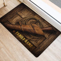 Western cowboy door mat placed by a doorway, featuring a rifle, leather gear and rope