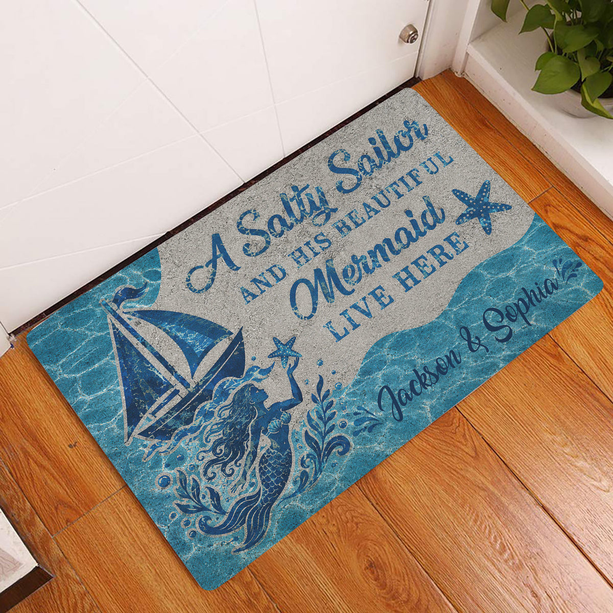 Blue mermaid entryway rug displayed by a white door on a wood floor