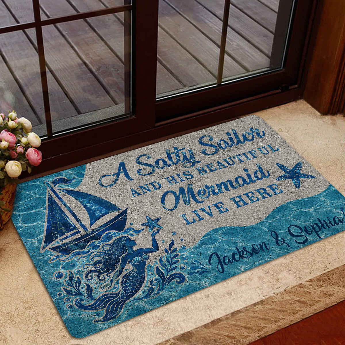 Mermaid welcome doormat shown in a home entrance with blue seaside artwork