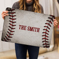 Baseball doormat held upright to show its full stitched design and centered lettering