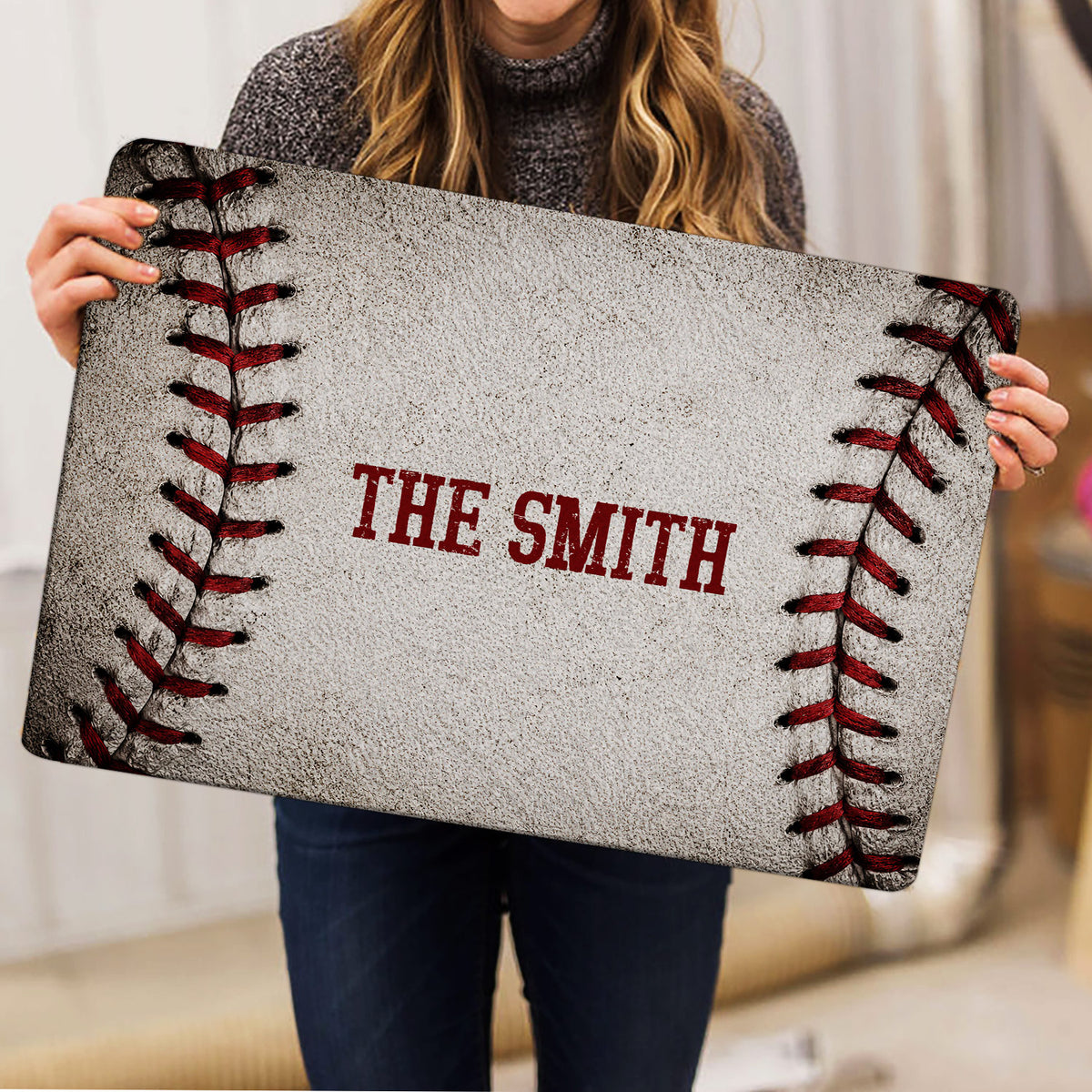 Baseball doormat held upright to show its full stitched design and centered lettering