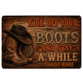 Rustic cowboy doormat with boots, hat, rope and western lettering on a weathered wood background