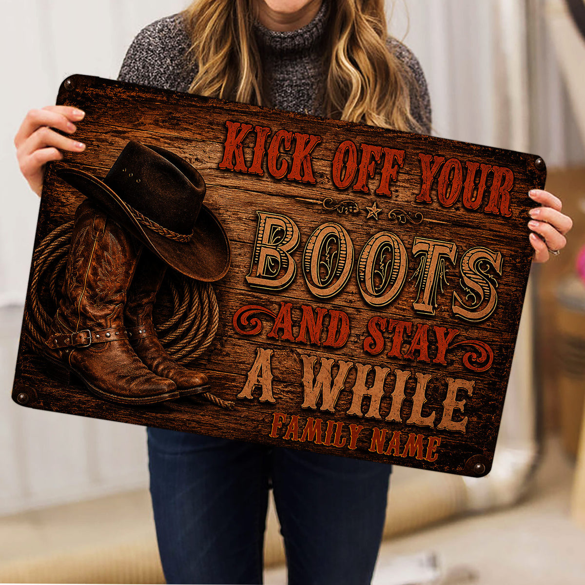 Cowboy doormat held indoors, showing rustic western artwork with boots, hat and rope