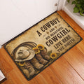 Cowboy and cowgirl western doormat displayed at an indoor entryway beside a white door and wood floor