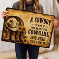 Person holding a western cowboy doormat featuring a hat, boots, sunflowers, and bold rustic lettering