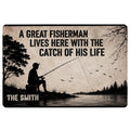 Fishing doormat with a silhouetted angler casting beside a lake, trees, birds and rustic shoreline artwork