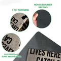 Close-up feature view of the fishing doormat showing its printed surface and dark rubber backing
