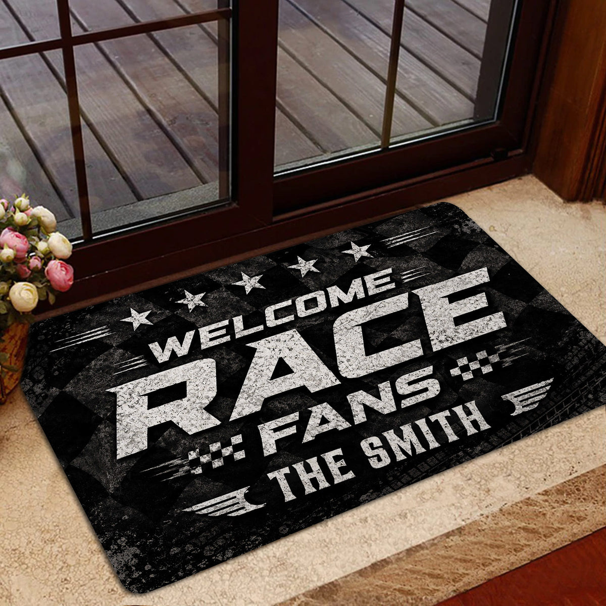 Racing welcome mat displayed in a home entrance with bold typography, stars, and checkered details