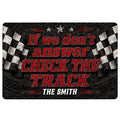 Racing doormat with bold red lettering, black background, checkered flags and track-inspired graphics