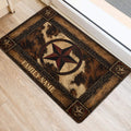 Western cowboy doormat placed beside a doorway with a distressed star design and woodgrain border