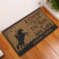 Cowboy entryway rug displayed beside a white door on a warm wood floor with rustic Western artwork