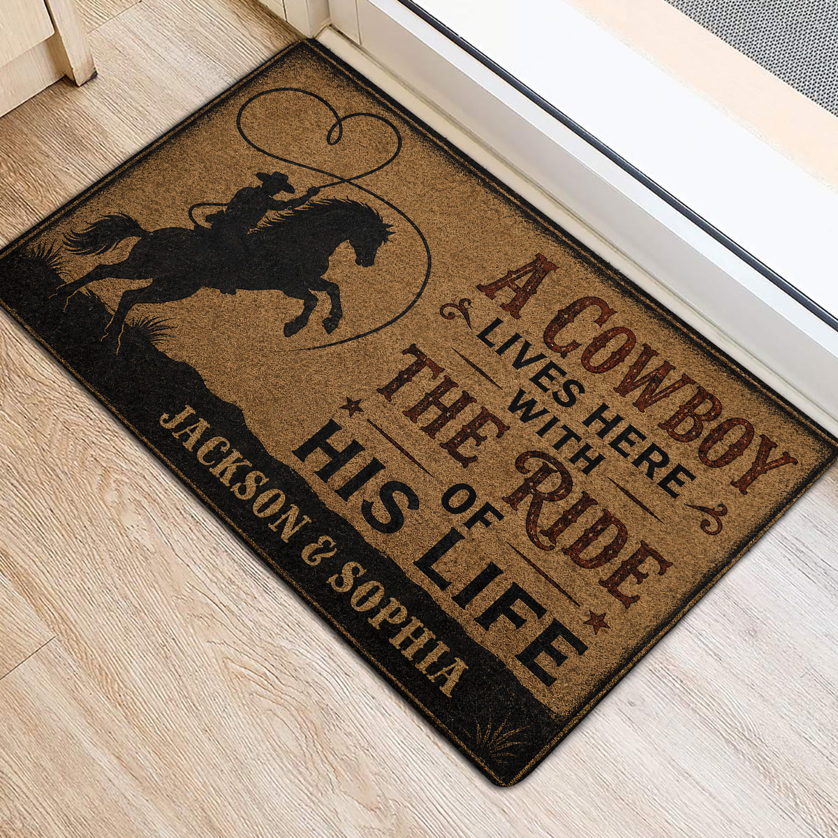 Western cowboy door mat placed at an entrance, featuring a rider on horseback and rustic typography