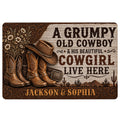 Western cowboy doormat featuring boots, a cowboy hat, floral scrollwork, desert scenery and rustic lettering