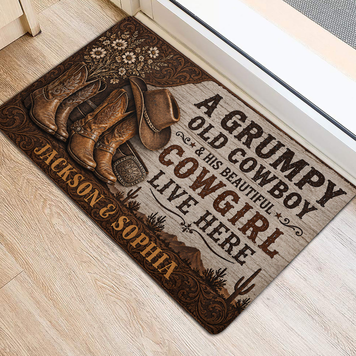 Western cowboy door mat positioned by a bright entryway with boots, hat, flowers and desert artwork