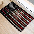 Red, white, and black baseball doormat positioned beside an indoor doorway