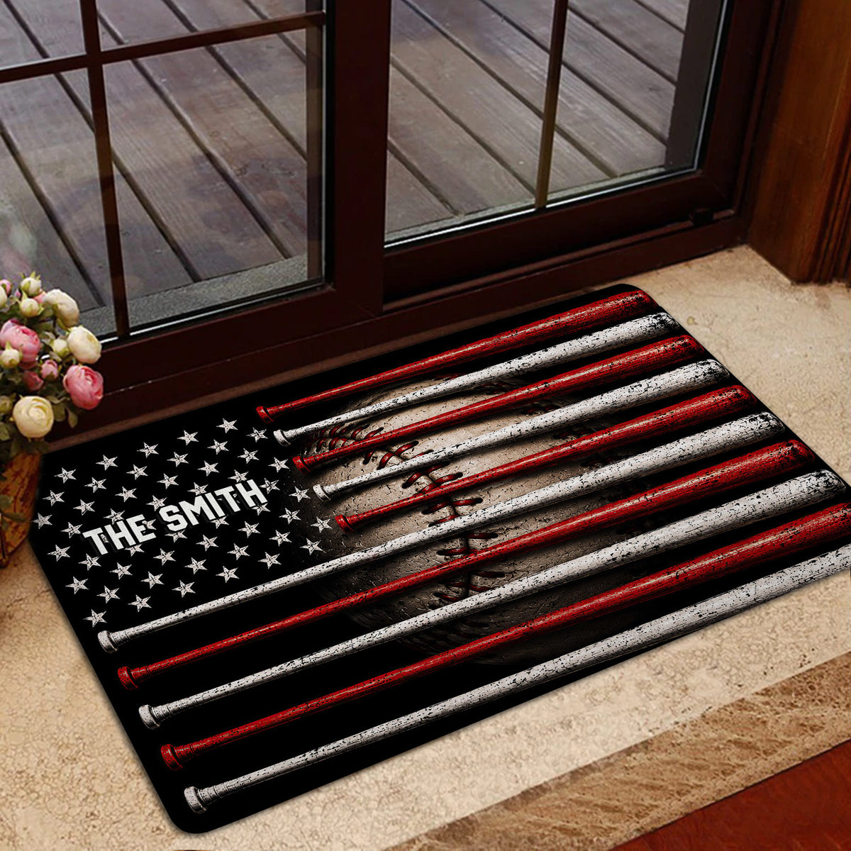 Baseball bat entryway mat styled in front of a glass door with a neutral interior