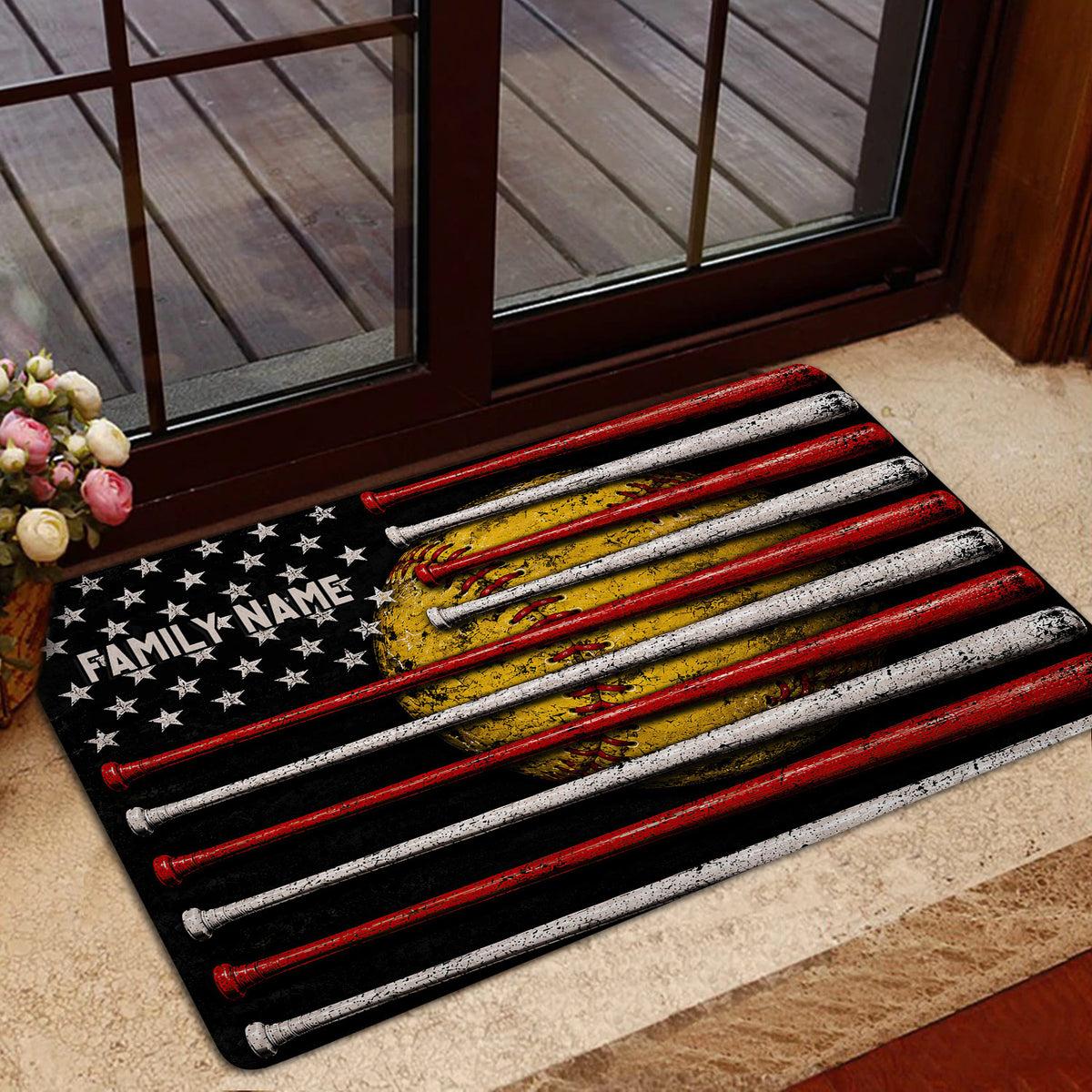Softball door mat in a home entryway featuring colorful bats, a glove, stars, and dark artwork