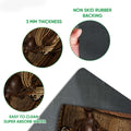 Close-up feature view of the cowboy doormat artwork and dark rubber backing
