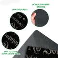 Doormat feature view showing the printed surface, rubber backing, rounded corners, and thin profile