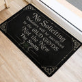 Black witchcraft-themed door mat beside a doorway with crescent moons, pentagram, and ornate details