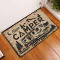 Camping RV doormat displayed inside a home entryway on warm wood flooring