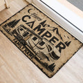 Mountain and RV camping doormat styled beside a bright home doorway