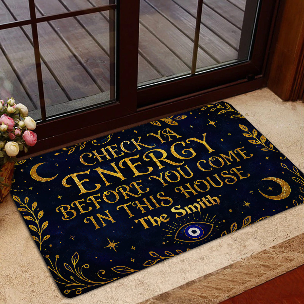 Evil eye doormat shown in a home entrance with gold celestial artwork and decorative botanical border