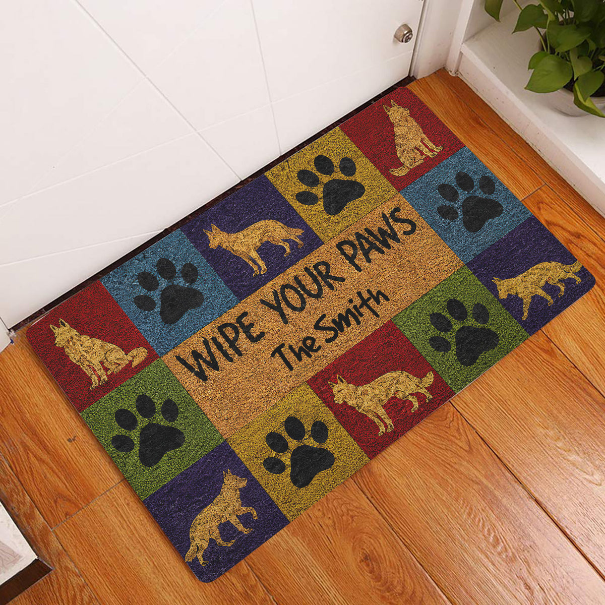 German Shepherd paw print doormat displayed by an indoor door on a wood floor