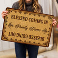 Christian blessing doormat held indoors, showing the ornate border and decorative faith-inspired typography