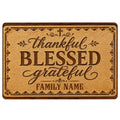 Christian doormat with a cross, ornate border, and warm wood-toned artwork featuring thankful and blessed themes