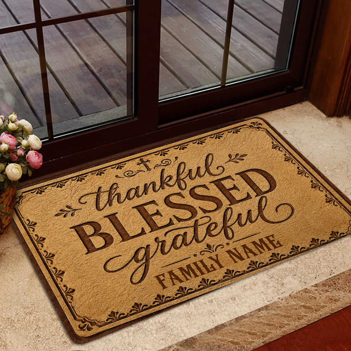 Faith-inspired Christian doormat styled near a glass door with warm brown artwork and an ornate decorative border