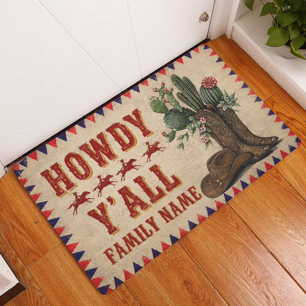 Cowboy entryway doormat displayed on a wood floor with cactus, cowboy boots, hat, riders, and Western lettering