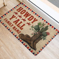 Western cowboy door mat shown at an entrance with rodeo riders, cactus, boots, hat, and a red blue geometric border