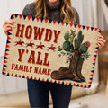 Western cowboy doormat held indoors, featuring cactus, cowboy boots, hat, horseback riders, and bold retro lettering