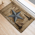 Rustic Texas star door mat positioned near an entrance with western wood and metal hardware artwork