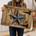 Person holding a rustic Texas western doormat featuring a star, horseshoe, lasso, and sheriff badge