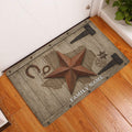 Texas western entryway doormat displayed beside a white door on a warm wood floor